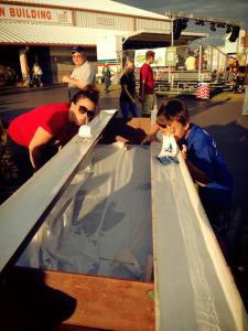 Doing the boat races at the Boy Scout booth.